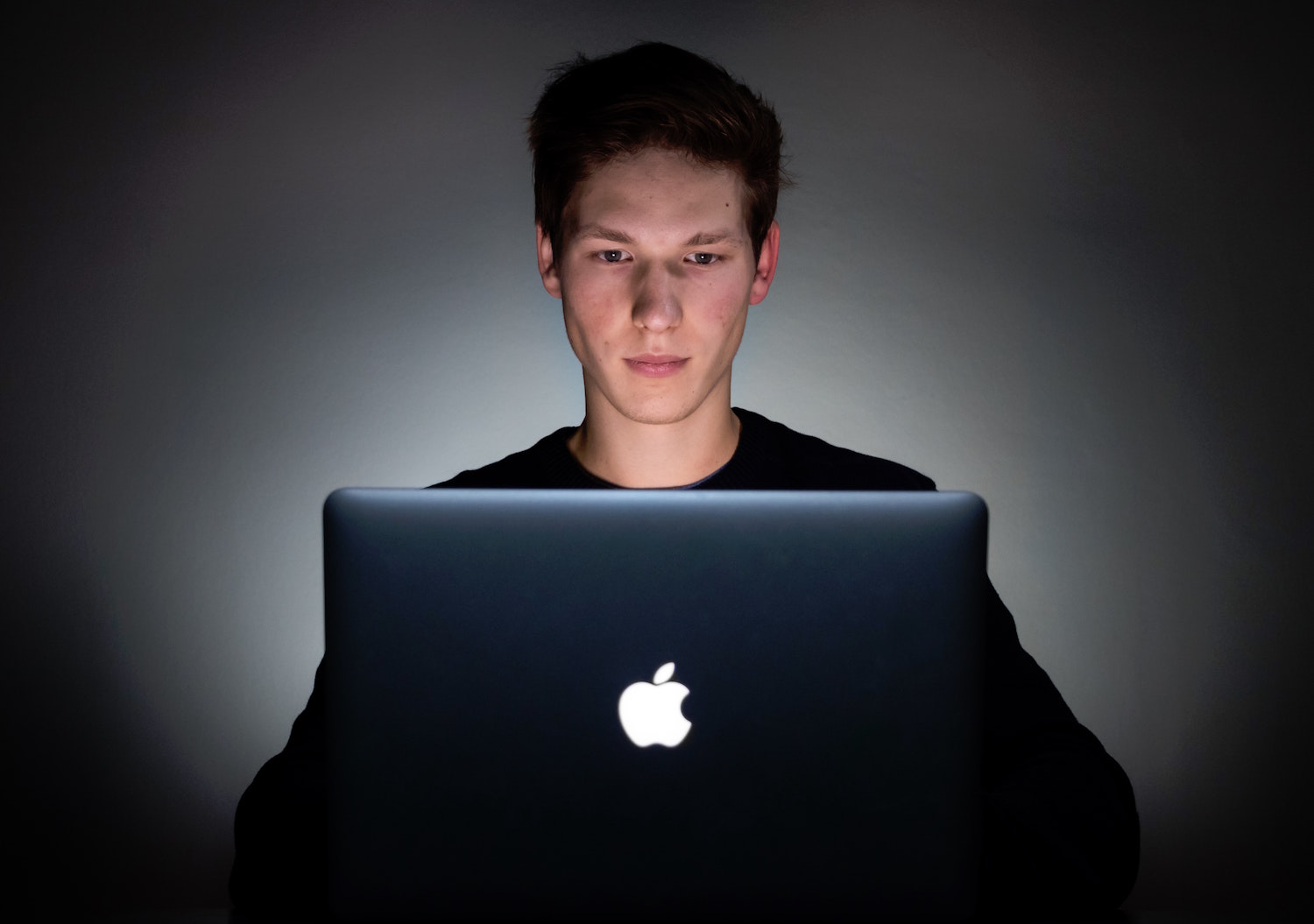 Man at computer screen at work